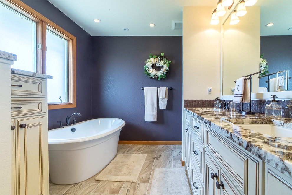 Example of a mid-sized classic 3/4 gray tile and porcelain tile porcelain tile and beige floor bathroom design in Denver with recessed-panel cabinets, white cabinets, white walls, an undermount sink, granite countertops and a hinged shower door