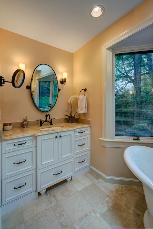Example of a large minimalist master beige tile and ceramic tile ceramic tile bathroom design in DC Metro with a console sink, furniture-like cabinets, white cabinets, granite countertops and beige walls