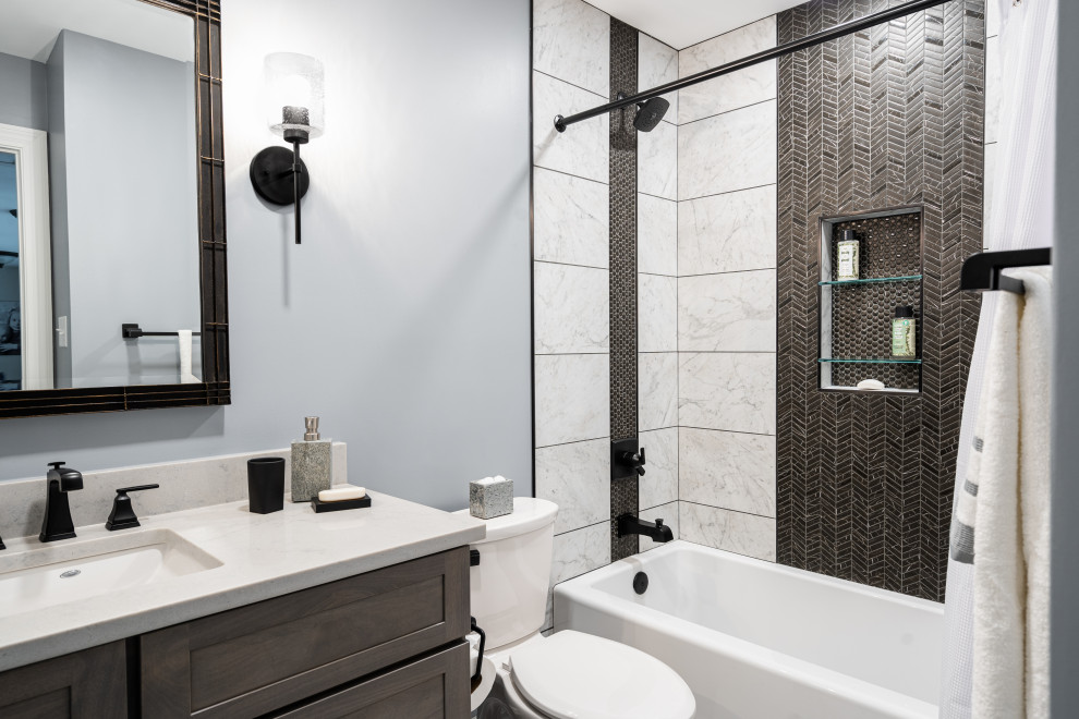 Bathroom - mid-sized contemporary kids' black and white tile and ceramic tile porcelain tile, white floor and single-sink bathroom idea in St Louis with flat-panel cabinets, medium tone wood cabinets, a two-piece toilet, gray walls, an undermount sink, quartz countertops, white countertops, a niche and a built-in vanity