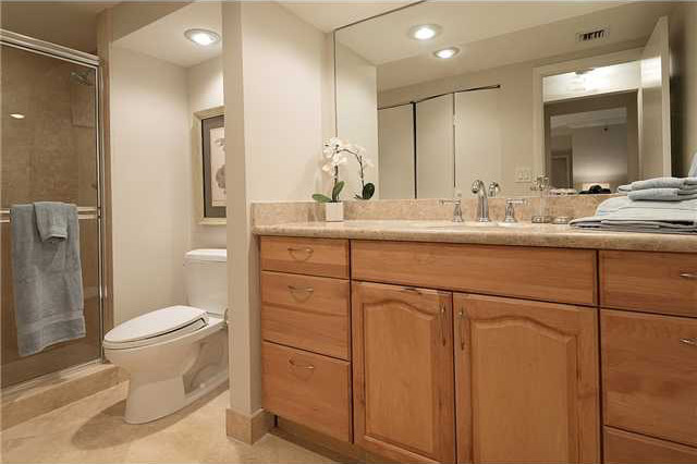 Example of a large classic master beige tile and stone tile marble floor alcove shower design in Miami with shaker cabinets, light wood cabinets, a hot tub, a two-piece toilet, gray walls, an undermount sink and granite countertops