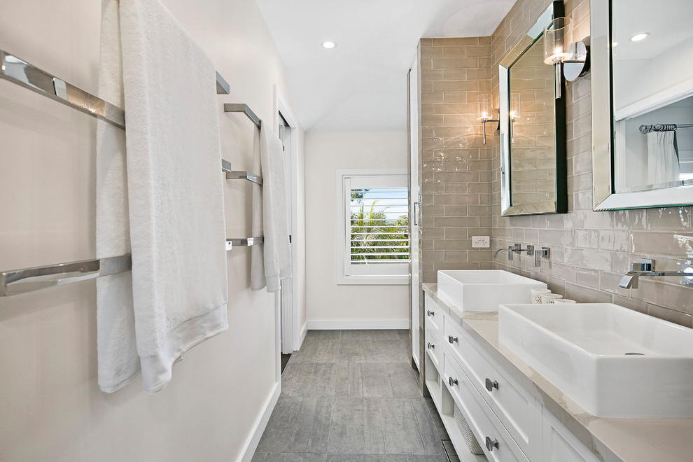 Mid-sized trendy master beige tile and subway tile gray floor bathroom photo in Sydney with shaker cabinets, white cabinets, an integrated sink and marble countertops