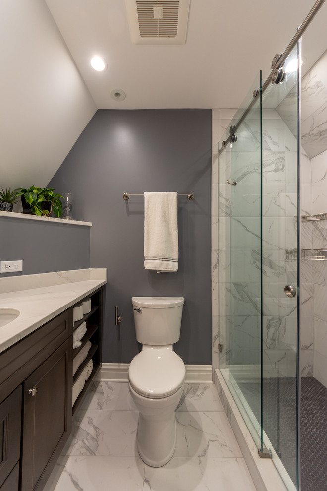 Inspiration for a mid-sized transitional kids' white tile and porcelain tile porcelain tile and white floor bathroom remodel in Chicago with shaker cabinets, dark wood cabinets, a two-piece toilet, gray walls, an undermount sink, quartz countertops and white countertops