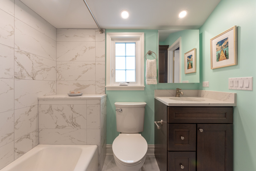 Medium sized traditional family bathroom in Chicago with shaker cabinets, grey cabinets, an alcove bath, a shower/bath combination, a two-piece toilet, white tiles, porcelain tiles, green walls, porcelain flooring, a submerged sink, engineered stone worktops, white floors, a shower curtain and white worktops.
