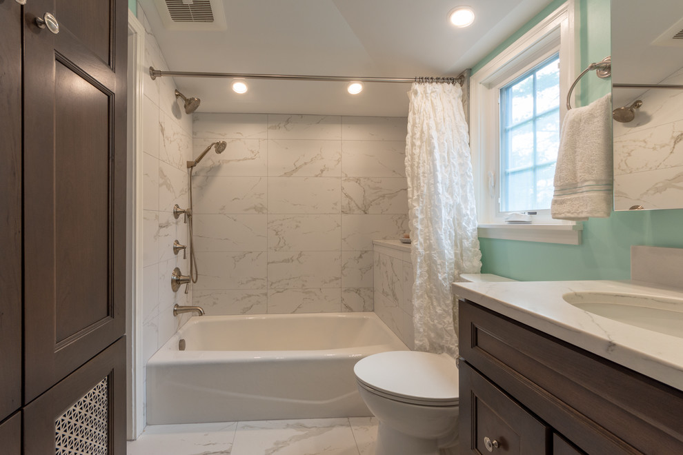 Bathroom - mid-sized transitional 3/4 white tile and porcelain tile porcelain tile and white floor bathroom idea in Chicago with shaker cabinets, gray cabinets, a two-piece toilet, green walls, an undermount sink, quartz countertops and white countertops