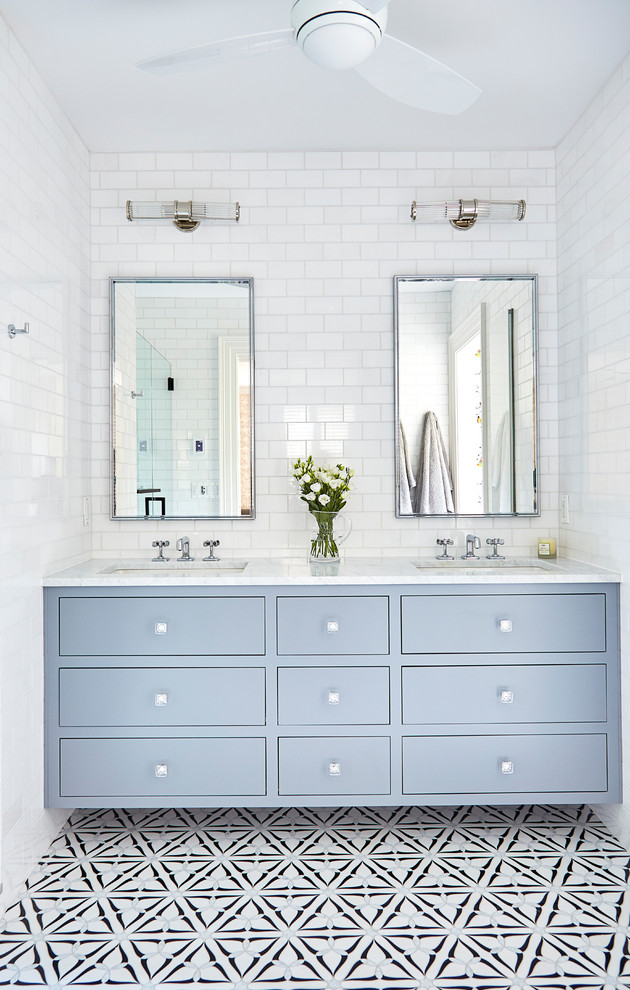 Mid-sized transitional master white tile and ceramic tile marble floor and multicolored floor alcove shower photo in Wilmington with flat-panel cabinets, gray cabinets, an undermount sink, marble countertops, a hinged shower door and white countertops