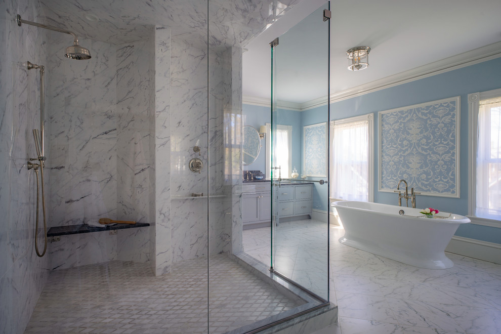 Freestanding bathtub - mid-sized victorian master marble tile marble floor and white floor freestanding bathtub idea in Boston with recessed-panel cabinets, gray cabinets, a one-piece toilet and blue walls