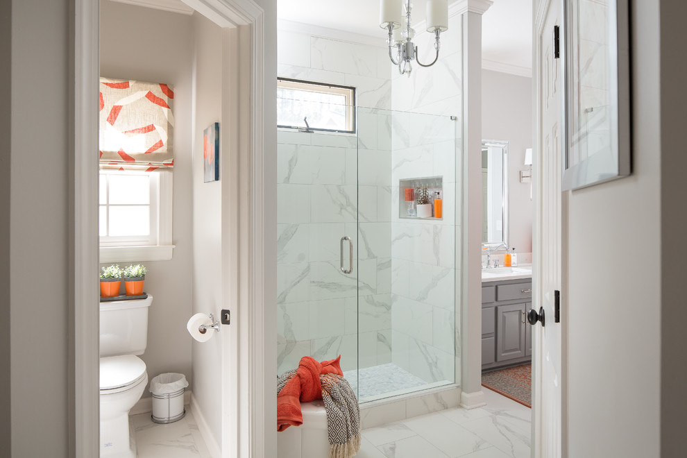 Large beach style 3/4 white tile and porcelain tile porcelain tile and white floor bathroom photo in Atlanta with shaker cabinets, gray cabinets, a two-piece toilet, blue walls, quartzite countertops, a hinged shower door, white countertops and an undermount sink