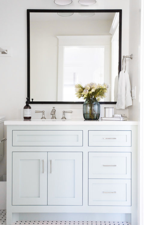 Design ideas for a medium sized nautical bathroom in Salt Lake City with blue cabinets, a built-in bath, a shower/bath combination, white walls, a console sink and a shower curtain.