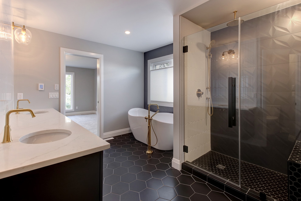 Medium sized traditional ensuite bathroom in Edmonton with recessed-panel cabinets, black cabinets, a freestanding bath, an alcove shower, white tiles, ceramic tiles, grey walls, ceramic flooring, a submerged sink, engineered stone worktops, black floors, a hinged door and white worktops.
