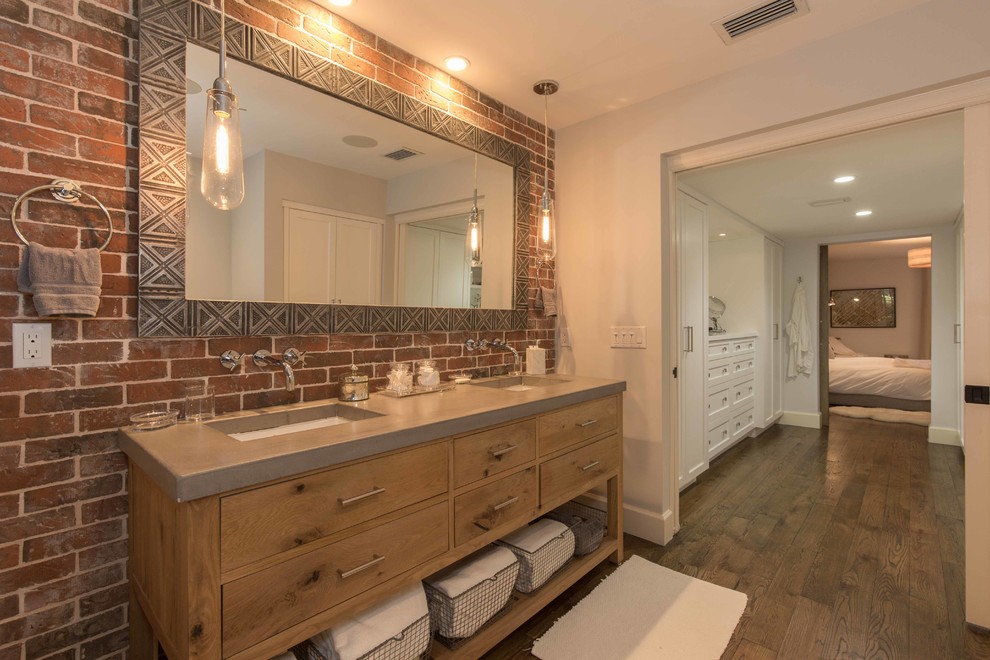 Inspiration for a large eclectic master gray tile and stone tile medium tone wood floor bathroom remodel in Miami with furniture-like cabinets, light wood cabinets, a one-piece toilet, white walls, an undermount sink and concrete countertops