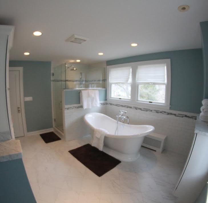 Bathroom - traditional master white tile and subway tile porcelain tile bathroom idea in Chicago with an undermount sink, recessed-panel cabinets, white cabinets, marble countertops, a one-piece toilet and blue walls