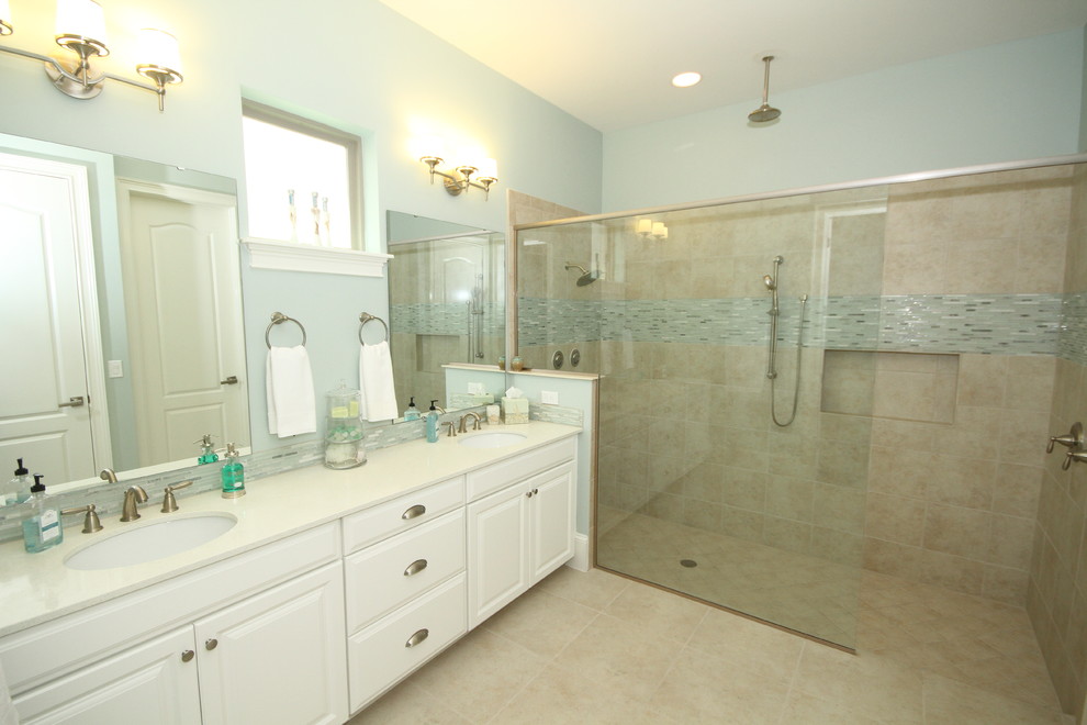 Large beach style master double shower photo in Orlando with an undermount sink, raised-panel cabinets, white cabinets and blue walls