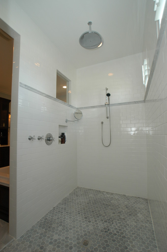 Inspiration for a contemporary bathroom in Orlando with metro tiles and grey floors.