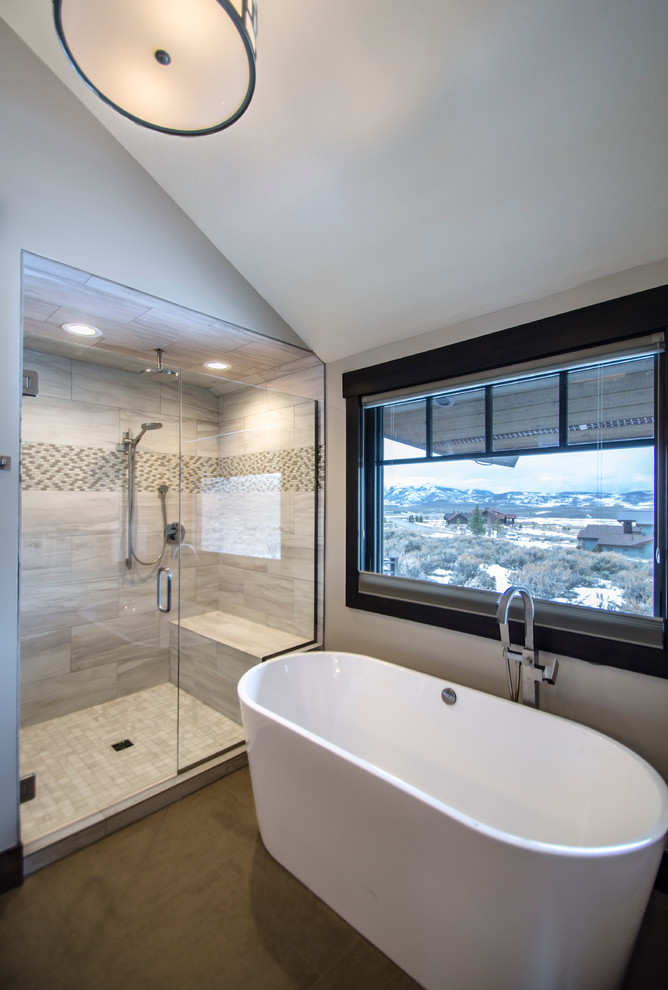 Large rustic ensuite bathroom in Salt Lake City with a freestanding bath, an alcove shower, beige tiles, mosaic tiles, white walls and porcelain flooring.