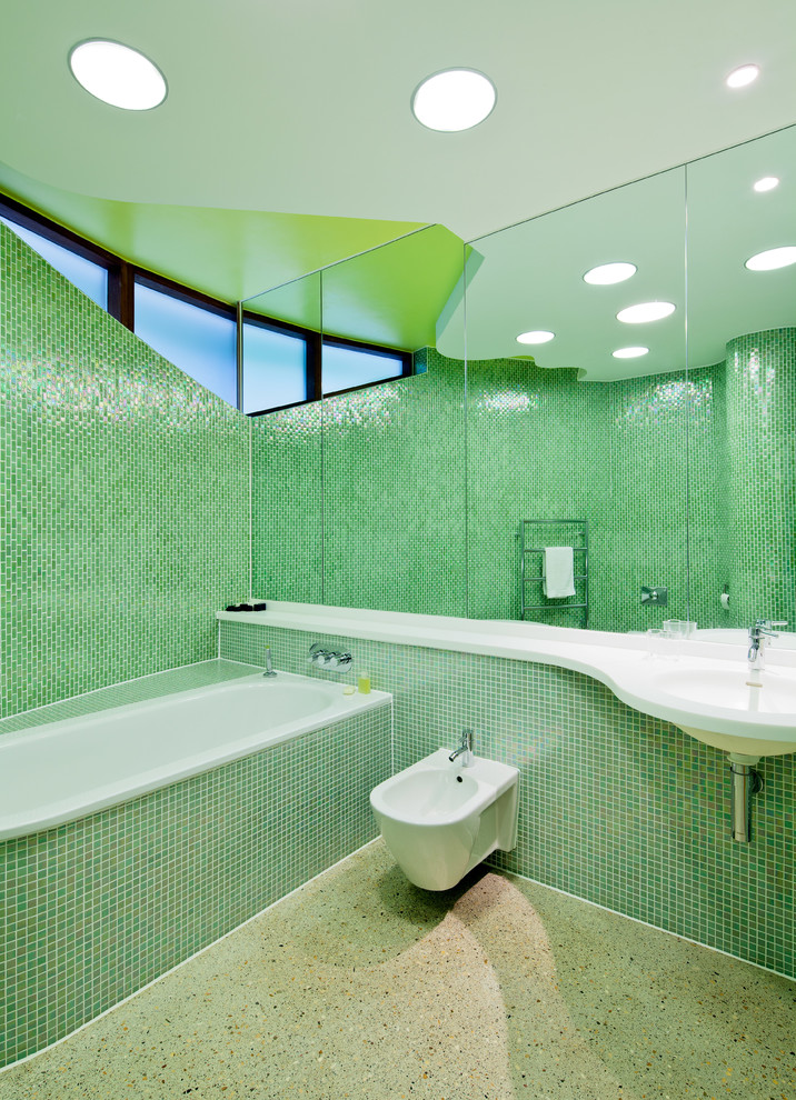 Contemporary bathroom in London with green tiles and mosaic tiles.