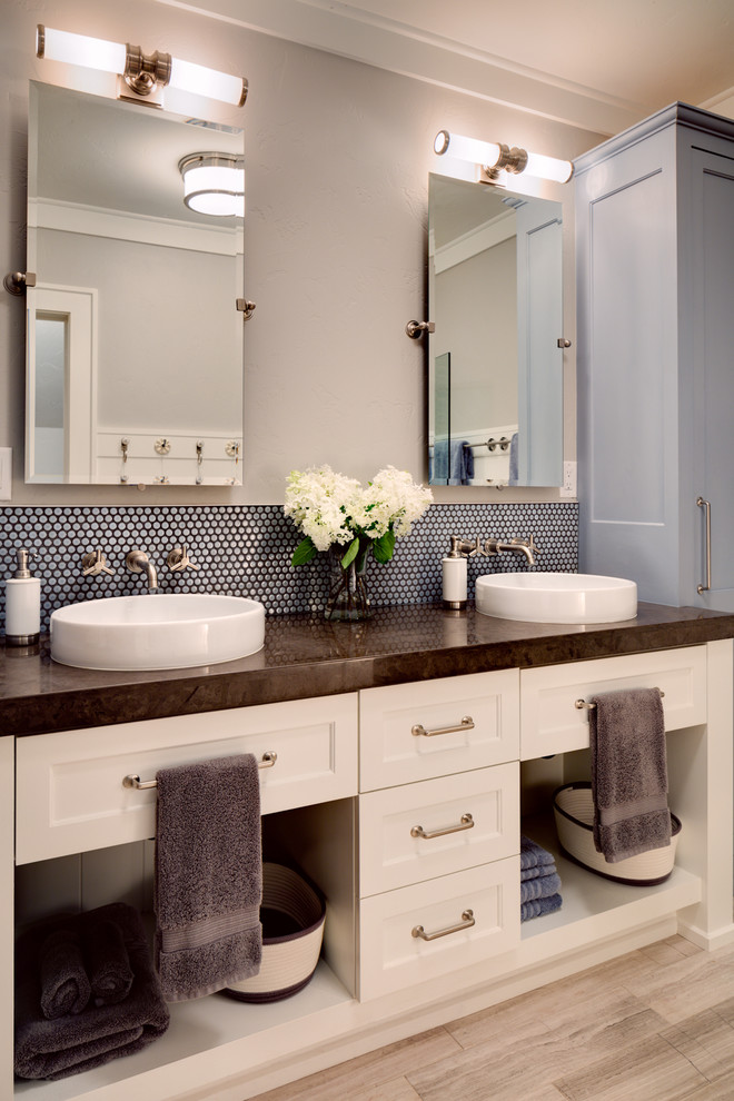 Inspiration for a rural bathroom in Chicago with recessed-panel cabinets, white cabinets, grey walls and a vessel sink.