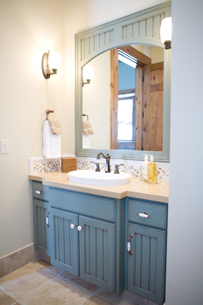 Inspiration for a mid-sized rustic multicolored tile and mosaic tile porcelain tile bathroom remodel in Salt Lake City with recessed-panel cabinets, blue cabinets, quartz countertops and beige walls