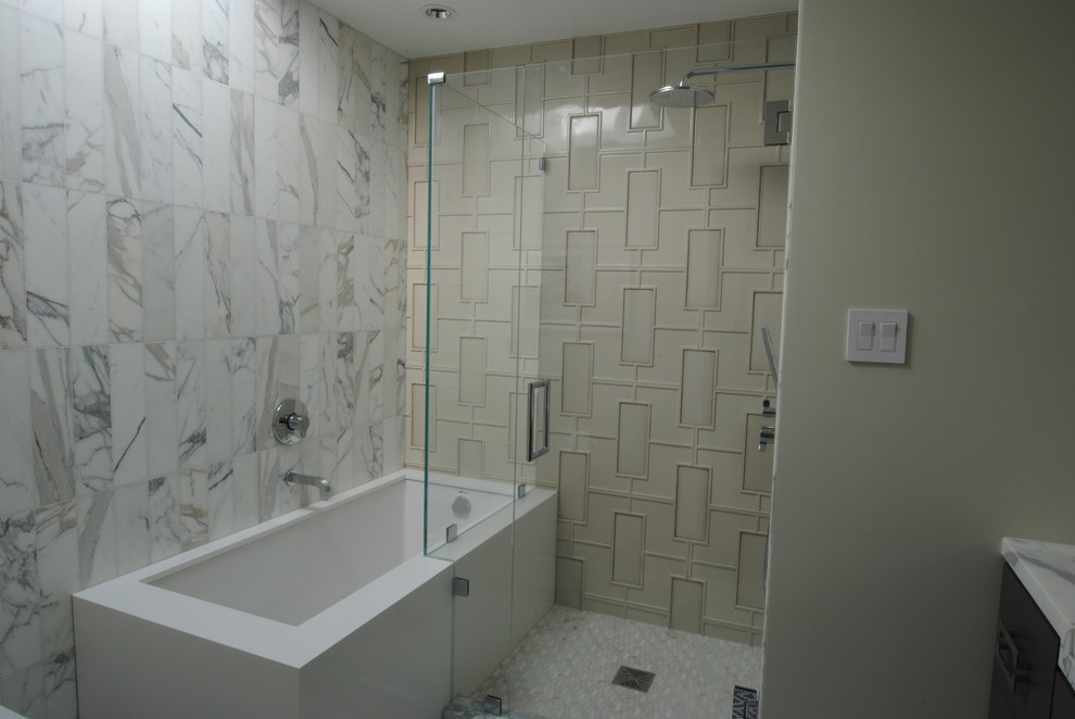 This is an example of a midcentury bathroom in San Francisco with a console sink, an alcove shower, a wall mounted toilet, stone tiles and marble flooring.