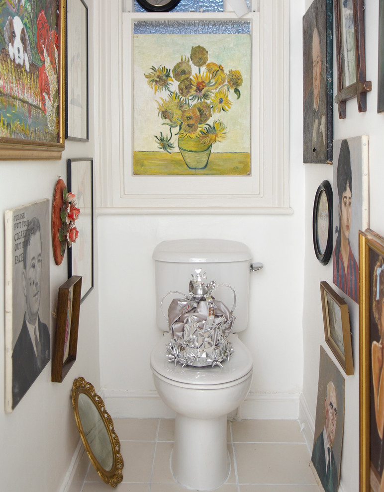 Inspiration for an eclectic powder room remodel in London