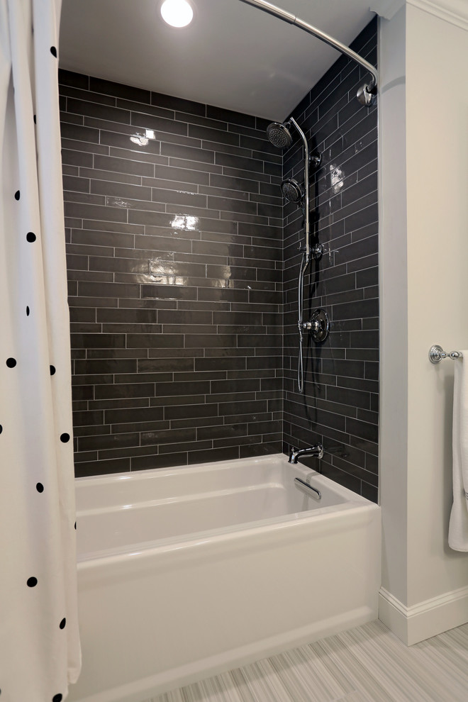 Design ideas for a classic family bathroom in Boston with flat-panel cabinets, white cabinets, an alcove bath, a shower/bath combination, a one-piece toilet, grey tiles, porcelain tiles, grey walls, porcelain flooring, a submerged sink and engineered stone worktops.