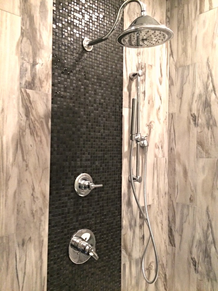 Design ideas for a modern ensuite bathroom in Houston with a vessel sink, recessed-panel cabinets, dark wood cabinets, marble worktops, a freestanding bath, a built-in shower, grey tiles, ceramic tiles, grey walls and ceramic flooring.