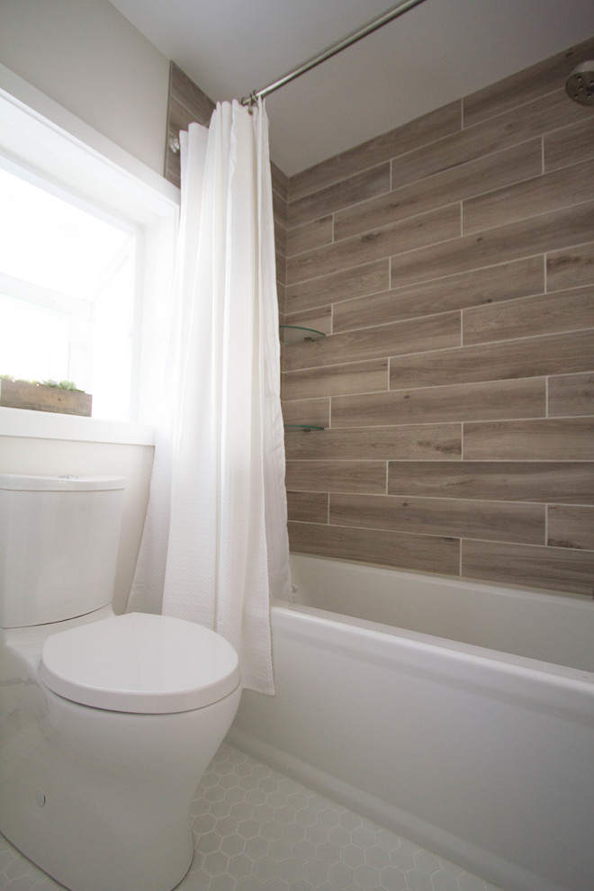This is an example of a small classic shower room bathroom in Philadelphia with flat-panel cabinets, dark wood cabinets, an alcove bath, a two-piece toilet, brown tiles, porcelain tiles, beige walls, porcelain flooring, a wall-mounted sink, solid surface worktops, white floors and a shower curtain.