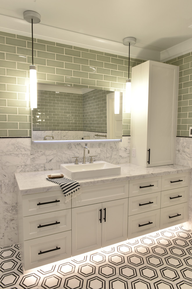 Inspiration for a classic ensuite bathroom in Other with flat-panel cabinets, white cabinets, a corner bath, a built-in shower, a one-piece toilet, green tiles, ceramic tiles, white walls, marble flooring, a vessel sink, marble worktops, white floors, a hinged door and white worktops.