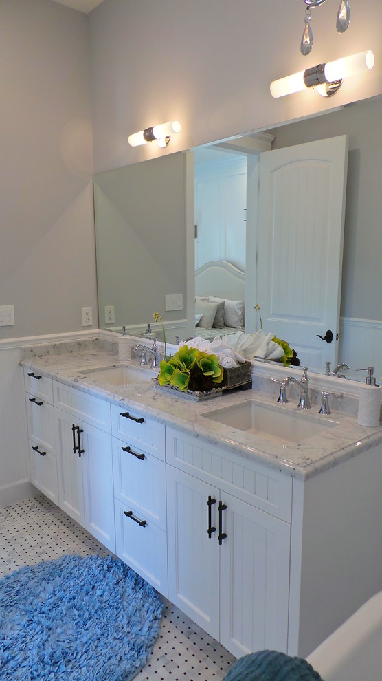 Example of a mid-sized arts and crafts master white tile and stone tile marble floor bathroom design in Los Angeles with an undermount sink, shaker cabinets, white cabinets, marble countertops and gray walls