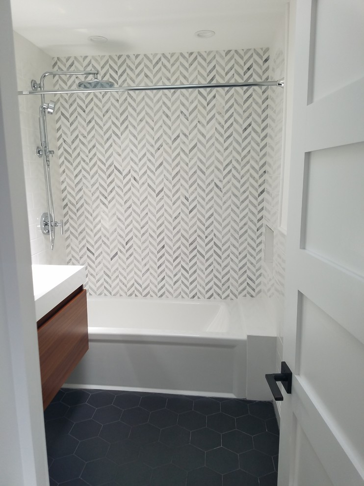 Photo of a large modern shower room bathroom in New York with flat-panel cabinets, brown cabinets, a corner bath, a shower/bath combination, white walls, porcelain flooring, a trough sink and grey floors.