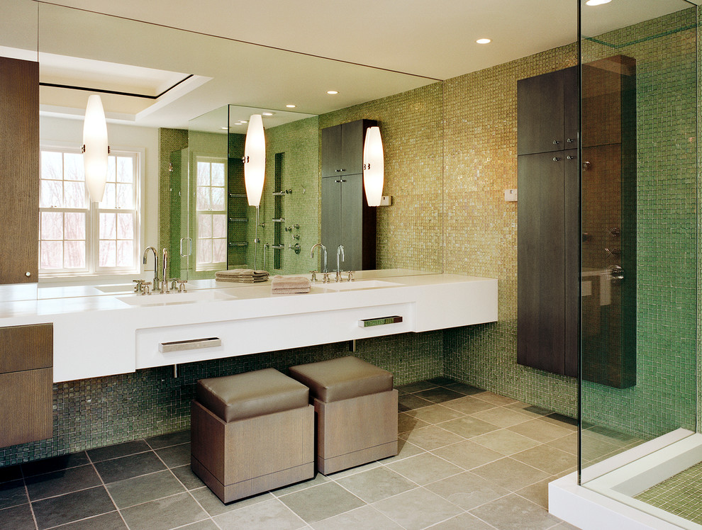 Example of a large eclectic master multicolored tile and glass tile doorless shower design in Philadelphia with an undermount sink, flat-panel cabinets, dark wood cabinets, solid surface countertops and a two-piece toilet