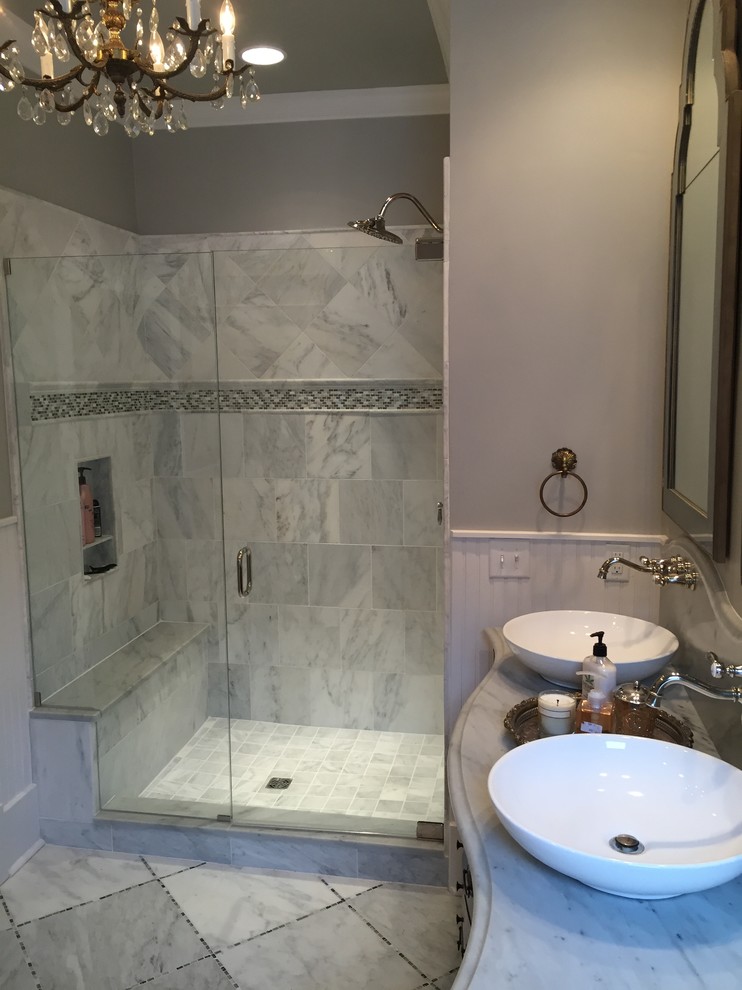 Large elegant master white tile and stone tile marble floor alcove shower photo in Nashville with a vessel sink, furniture-like cabinets, dark wood cabinets, marble countertops, a two-piece toilet and gray walls