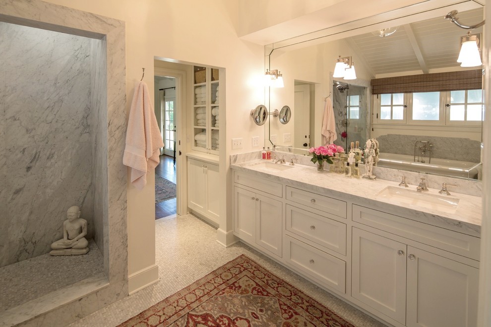 Inspiration for a mid-sized timeless master white tile and stone slab mosaic tile floor bathroom remodel in Los Angeles with shaker cabinets, white cabinets, white walls, an undermount sink and marble countertops