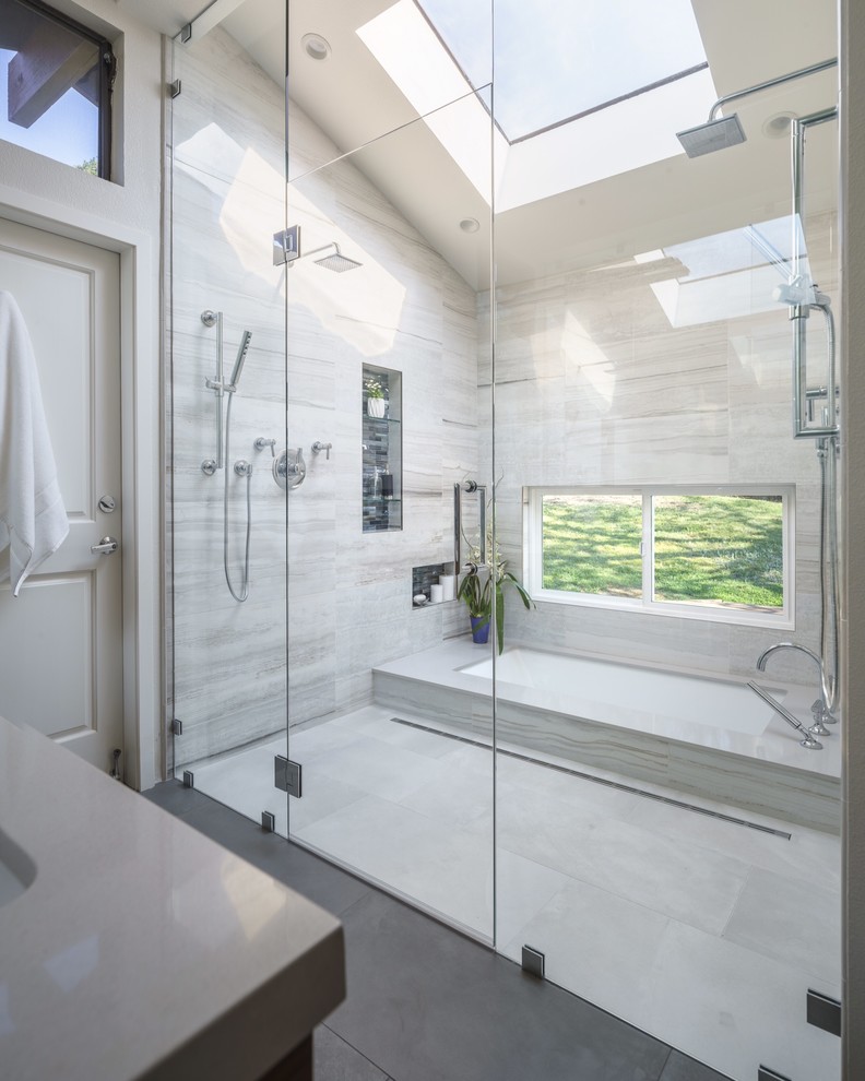 Inspiration for a large modern master multicolored tile and porcelain tile porcelain tile walk-in shower remodel in San Francisco with an undermount sink, medium tone wood cabinets, quartz countertops, an undermount tub, a one-piece toilet, gray walls and flat-panel cabinets