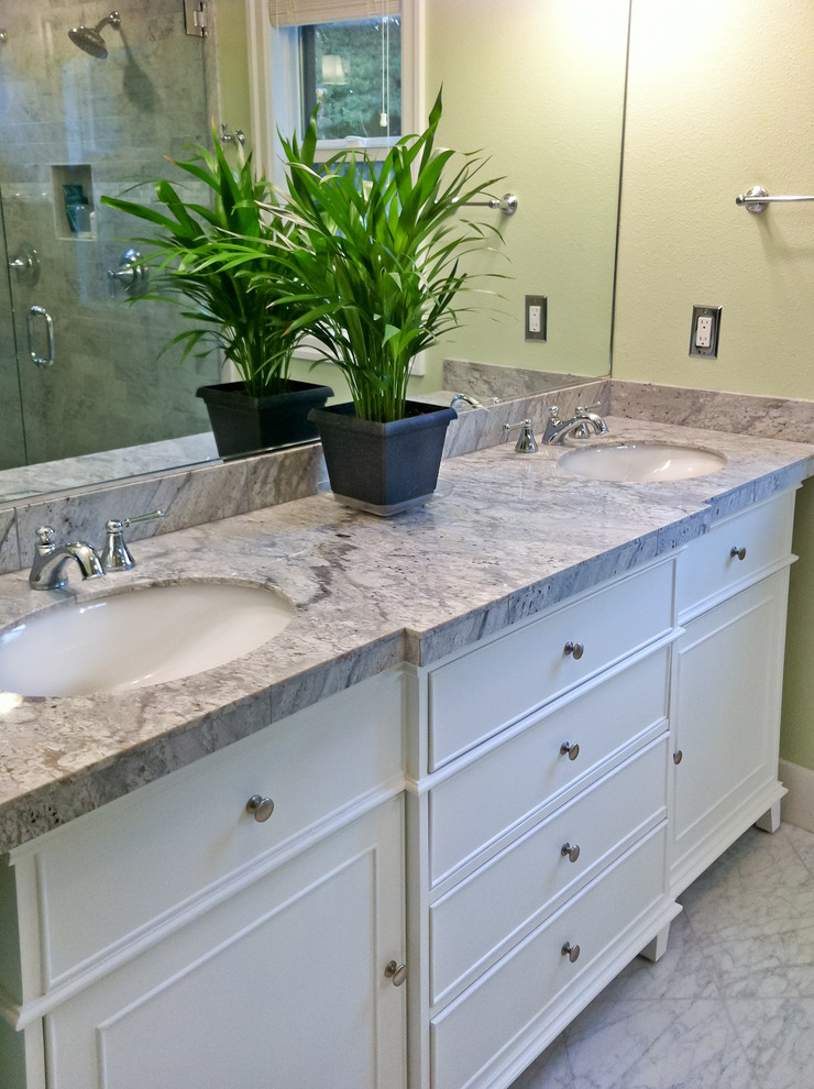 This is an example of a traditional ensuite bathroom in Portland with a submerged sink, white cabinets, granite worktops, a double shower, multi-coloured tiles, stone tiles, freestanding cabinets, green walls and marble flooring.