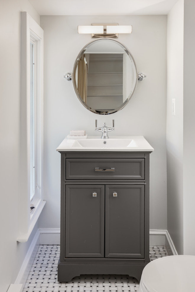 Bathroom - small traditional marble floor, gray floor and single-sink bathroom idea in DC Metro with furniture-like cabinets, gray cabinets, a two-piece toilet, gray walls, an integrated sink, solid surface countertops, white countertops and a freestanding vanity