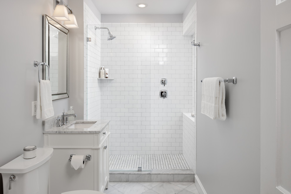 Inspiration for a small shower room bathroom in DC Metro with shaker cabinets, white cabinets, an alcove shower, a two-piece toilet, white tiles, ceramic tiles, grey walls, marble flooring, a submerged sink, marble worktops, grey floors, an open shower, grey worktops, a single sink and a freestanding vanity unit.