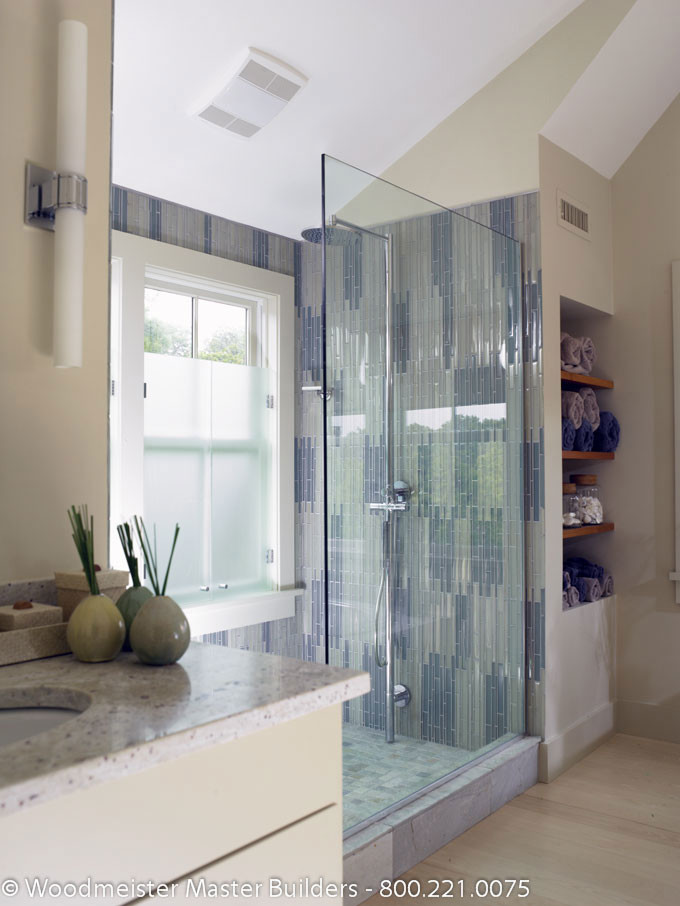 Mid-sized elegant master white tile and glass tile light wood floor doorless shower photo in Boston with flat-panel cabinets, white cabinets, beige walls, an undermount sink and marble countertops