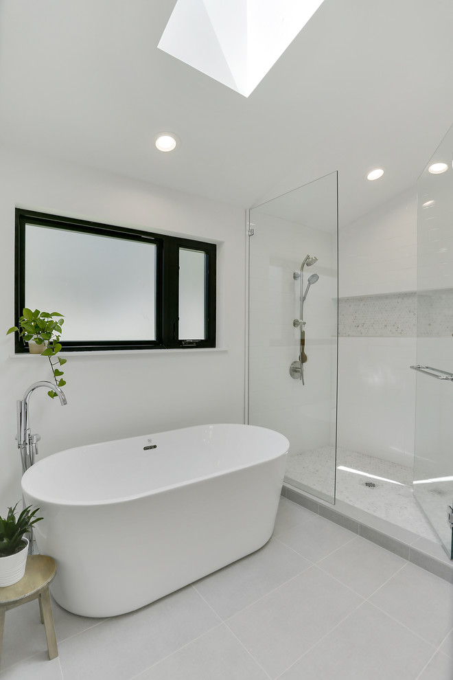 Example of a transitional master ceramic tile and white tile porcelain tile and gray floor bathroom design in Seattle with white walls and a hinged shower door