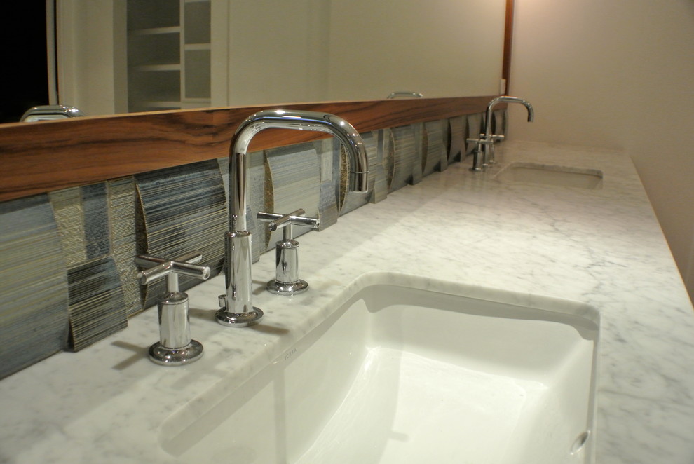 Example of a trendy gray tile tub/shower combo design in Los Angeles with an undermount sink, an undermount tub, a two-piece toilet, furniture-like cabinets, brown cabinets and marble countertops