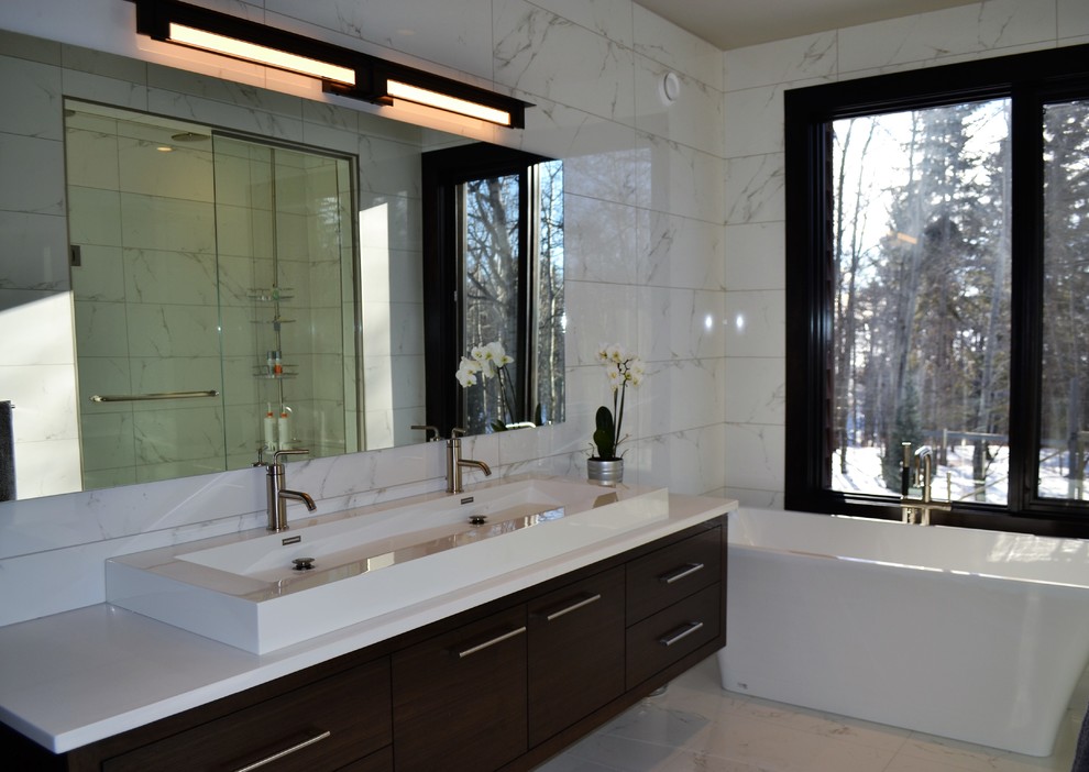 Bathroom - large contemporary master white tile and marble tile marble floor and white floor bathroom idea in Calgary with flat-panel cabinets, dark wood cabinets, white walls, a trough sink and quartz countertops