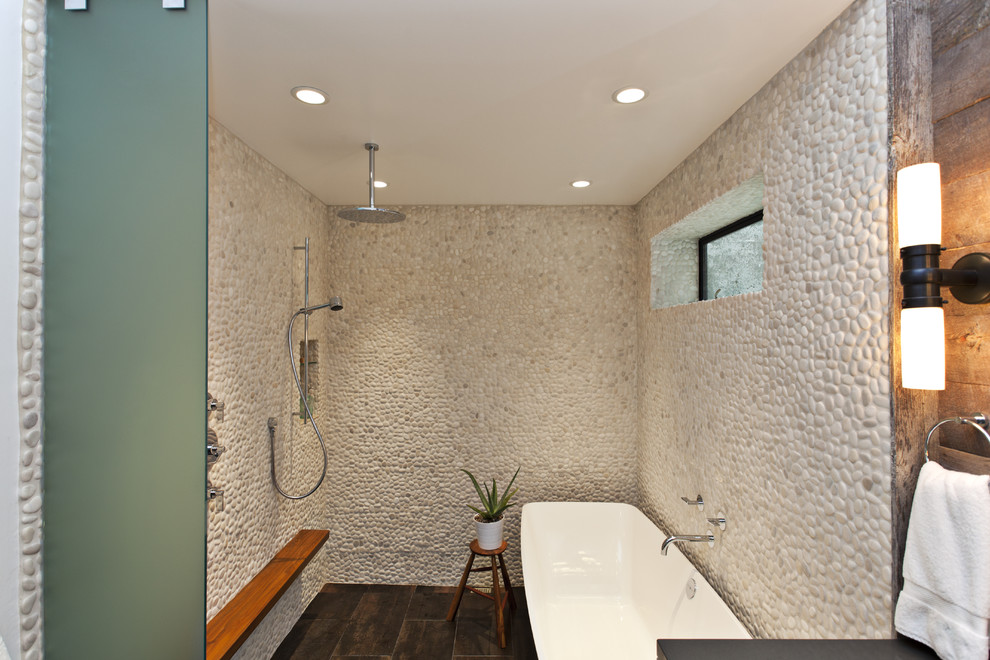 Trendy pebble tile freestanding bathtub photo in San Francisco