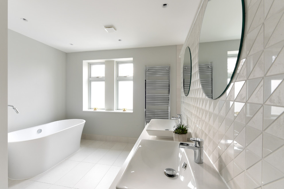 Photo of a contemporary bathroom in Oxfordshire with white tiles, porcelain tiles, porcelain flooring and white floors.