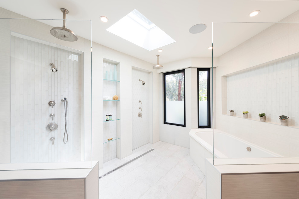 Example of a huge minimalist master white tile and glass tile marble floor and white floor bathroom design in San Diego with flat-panel cabinets, medium tone wood cabinets, a two-piece toilet, white walls, an undermount sink and quartzite countertops