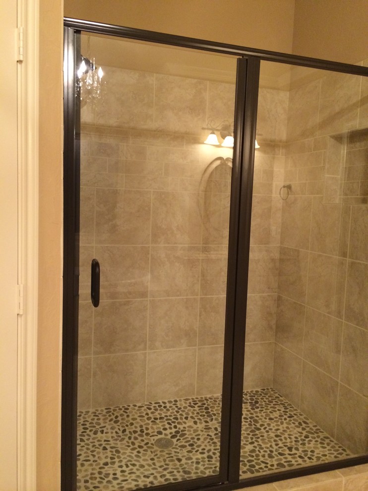 This is an example of a medium sized classic ensuite bathroom in Austin with an alcove shower, beige tiles, ceramic tiles, beige walls, pebble tile flooring, raised-panel cabinets, white cabinets, a built-in bath, a two-piece toilet, a submerged sink, granite worktops, beige floors and a hinged door.