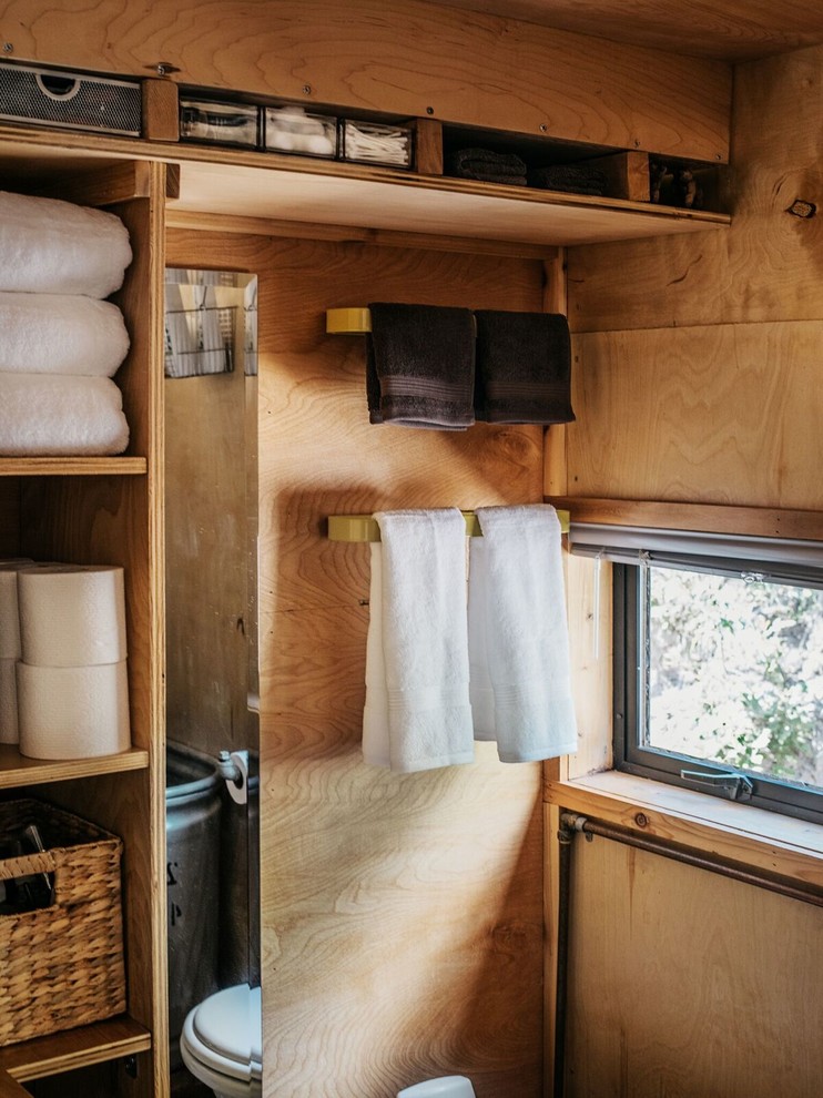 Bathroom - small rustic 3/4 bathroom idea in Denver with open cabinets and light wood cabinets