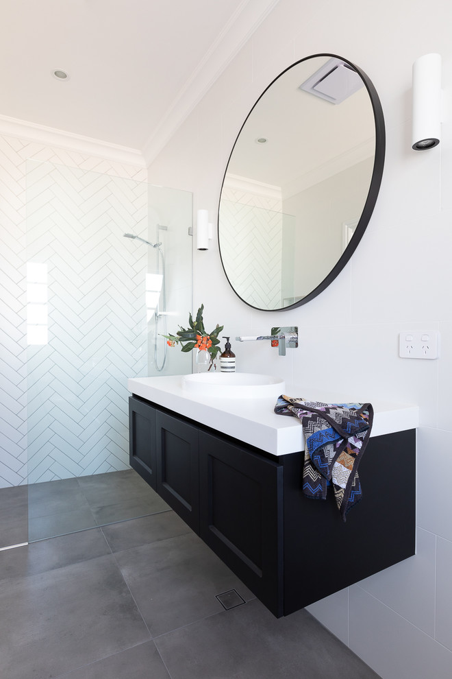 Bathroom - contemporary white tile and ceramic tile cement tile floor and gray floor bathroom idea in Brisbane with shaker cabinets, black cabinets, a one-piece toilet, white walls, an integrated sink, quartz countertops and white countertops