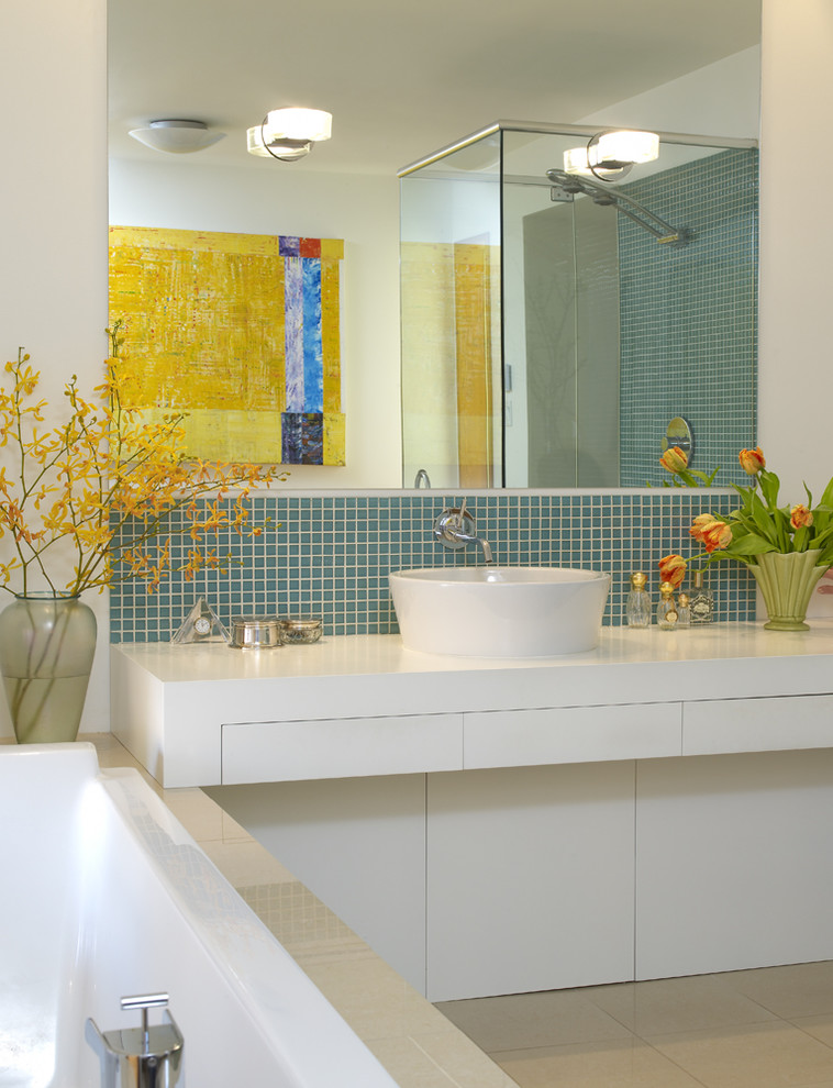 Inspiration for a modern bathroom in Vancouver with mosaic tiles, a vessel sink and feature lighting.