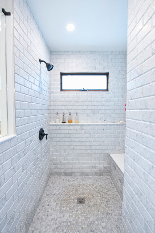 Inspiration for a large classic ensuite bathroom in Columbus with recessed-panel cabinets, white cabinets, a freestanding bath, a built-in shower, a two-piece toilet, marble tiles, laminate floors, a submerged sink, engineered stone worktops, grey floors, a hinged door, white worktops, white tiles and white walls.