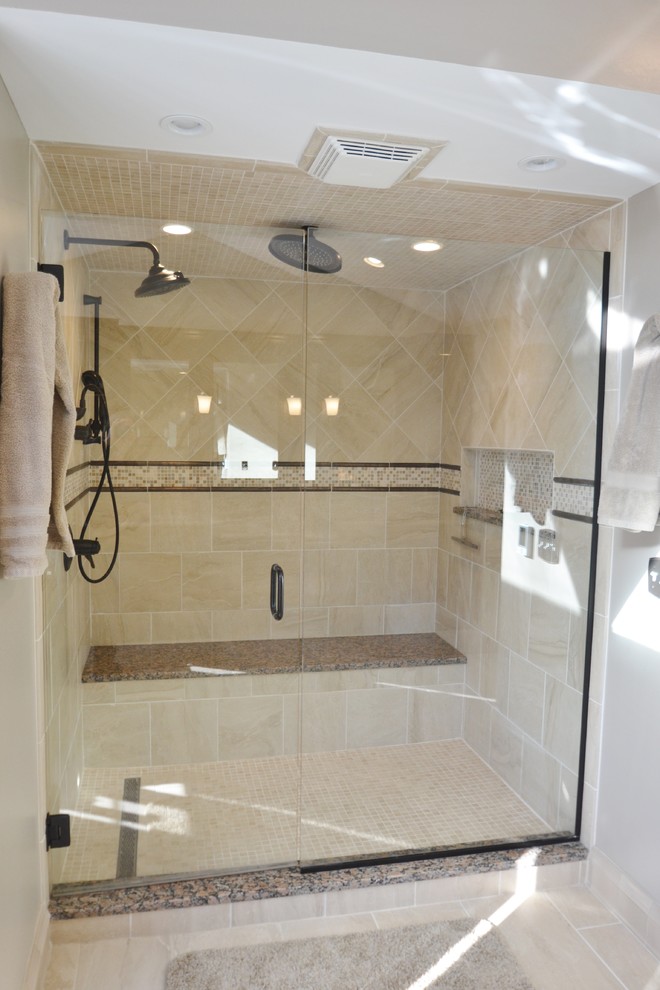 Example of a large transitional master black tile and porcelain tile porcelain tile bathroom design in Columbus with an undermount sink, recessed-panel cabinets, dark wood cabinets, granite countertops, a one-piece toilet and beige walls