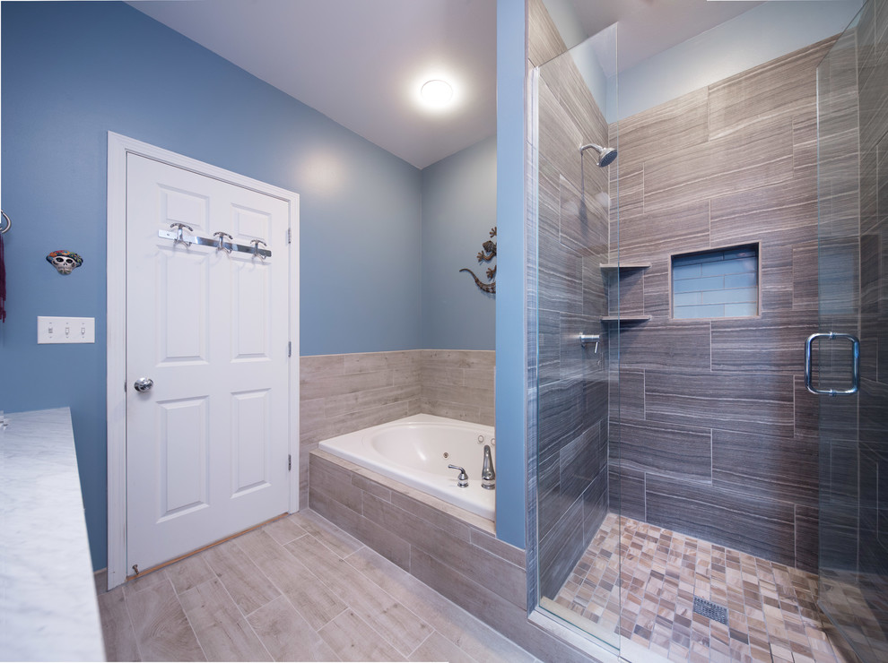 Bathroom - mid-sized modern master brown tile and ceramic tile ceramic tile bathroom idea in Chicago with shaker cabinets, dark wood cabinets, a two-piece toilet, blue walls, an undermount sink and marble countertops